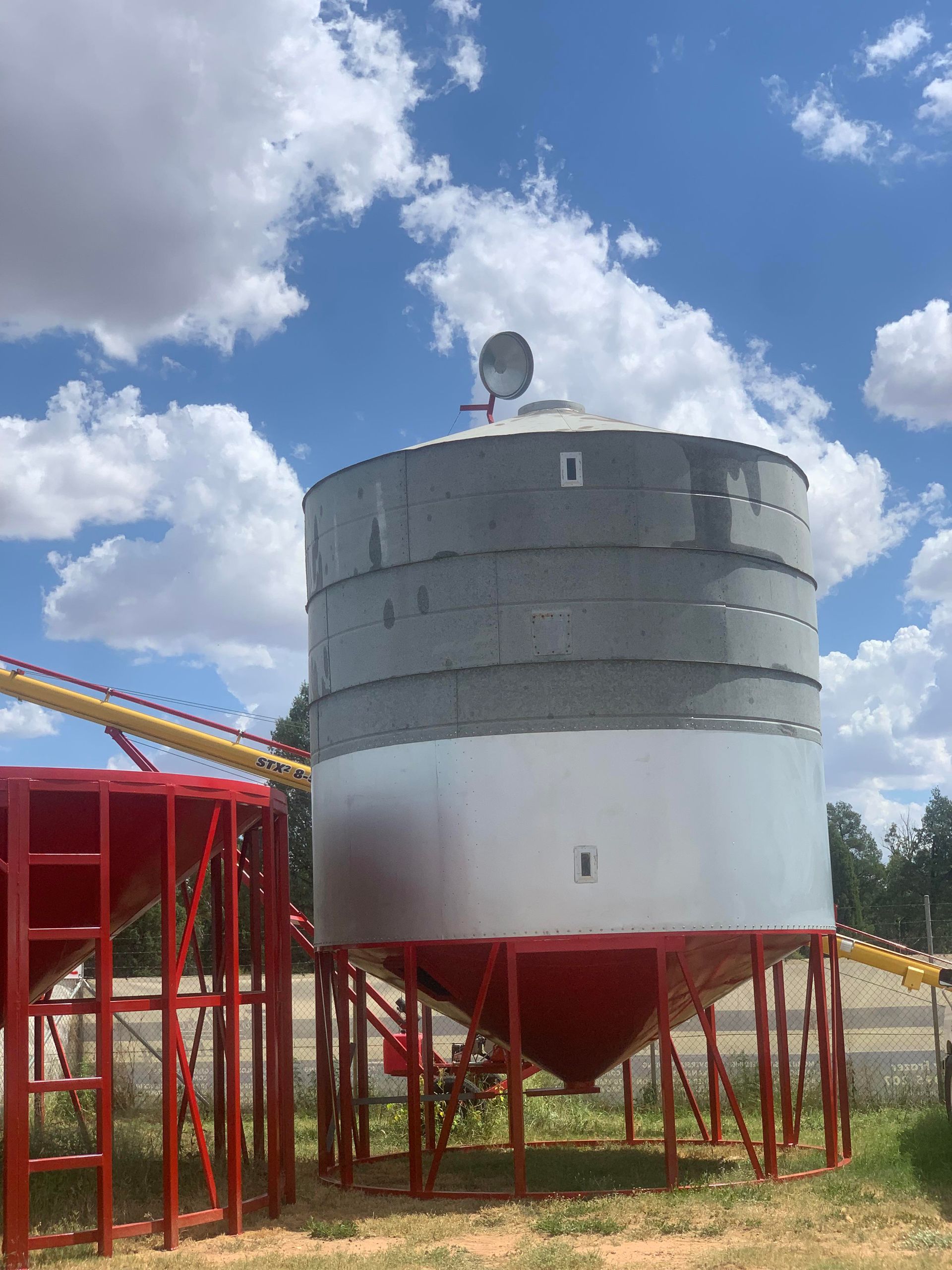 Two Silos Are Sitting Next to Each Other in a Field — Welders In Gilgandra, NSW