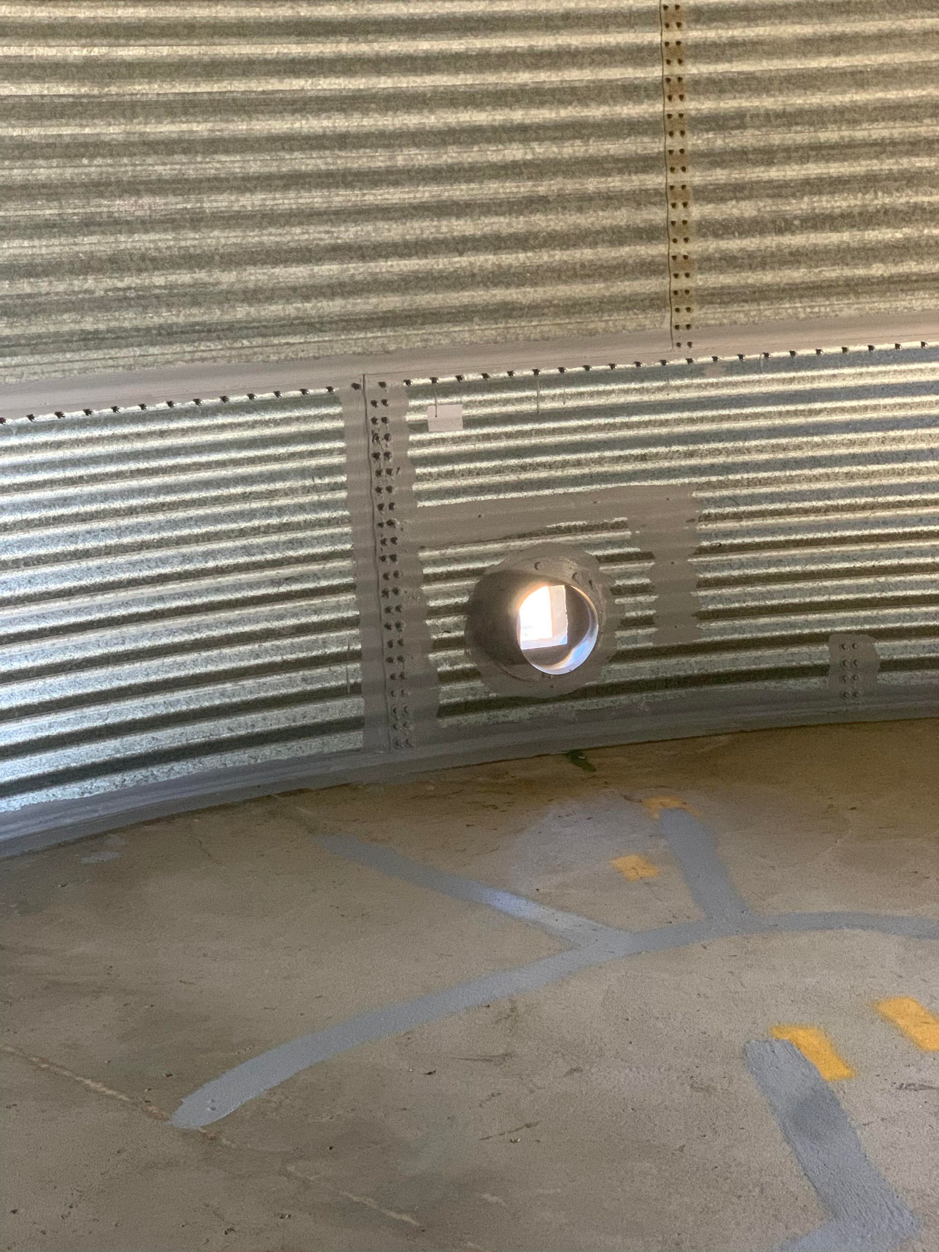 A Metal Wall With a Hole in the Middle of It — Welders In Gilgandra, NSW