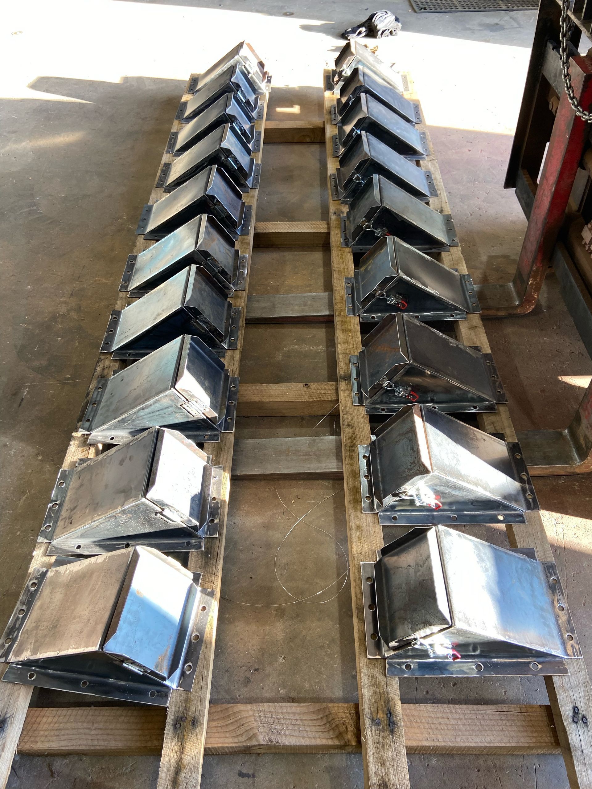 A Row of Metal Boxes Sitting on Top of a Wooden Pallet — Welders In Gilgandra, NSW