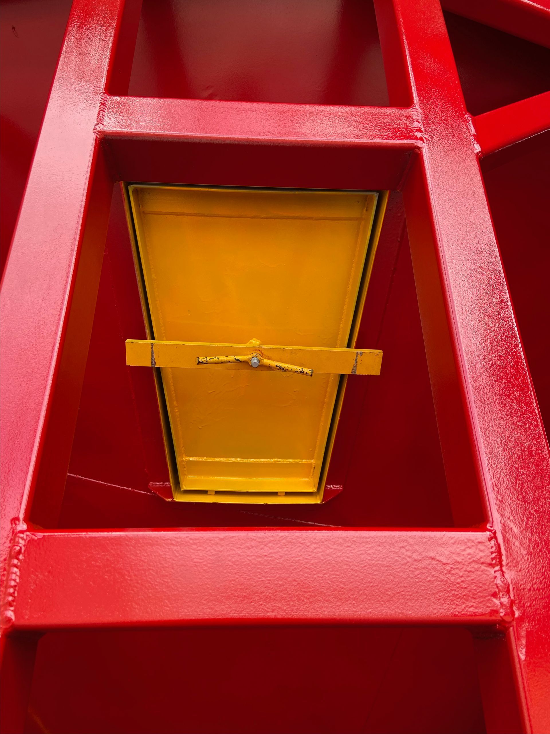 A Close Up of a Yellow Object on a Red Surface — Welders In Gilgandra, NSW