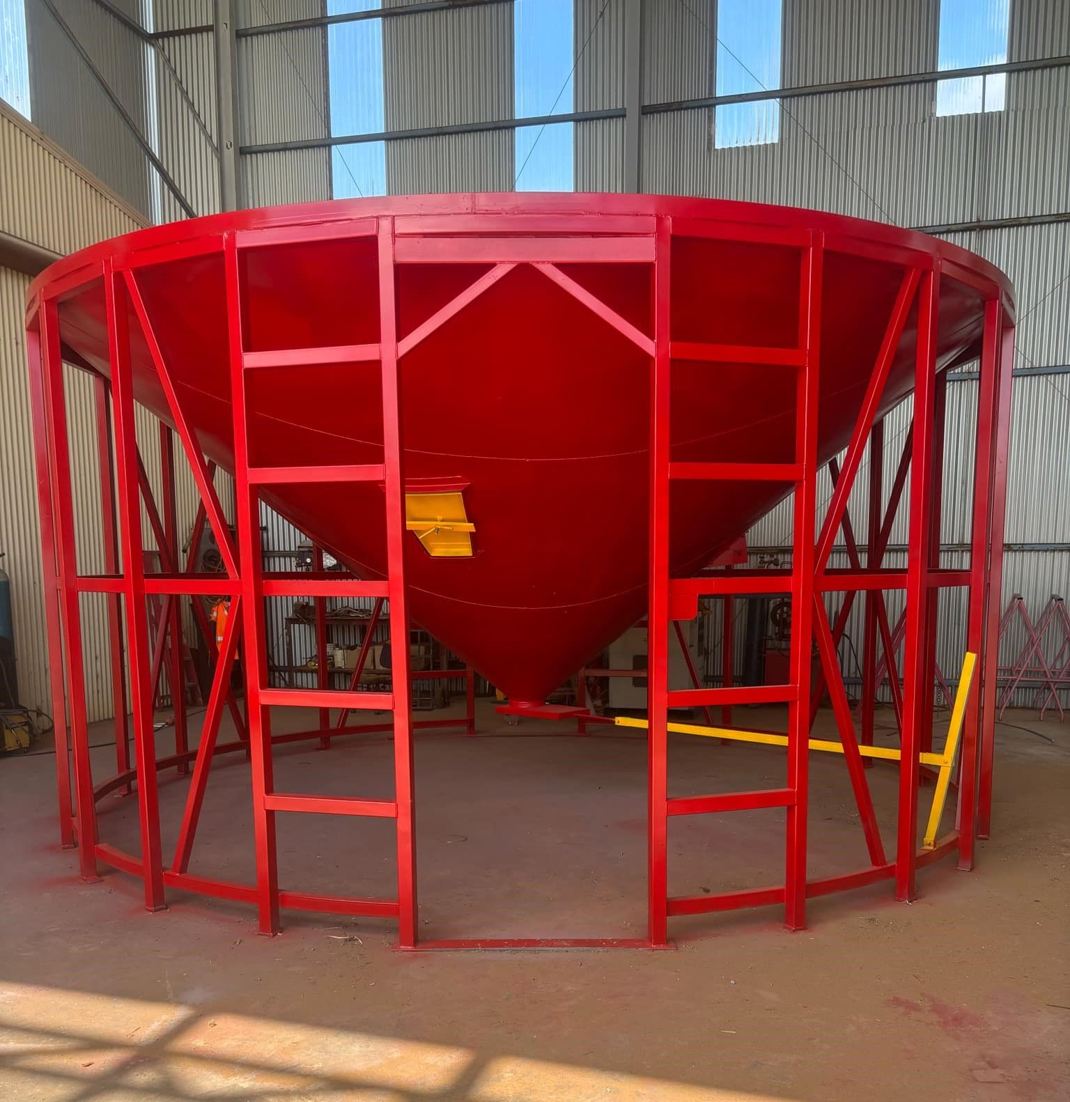 A Large Red Cone Shaped Structure With Stairs Surrounding It — Welders In Gilgandra, NSW