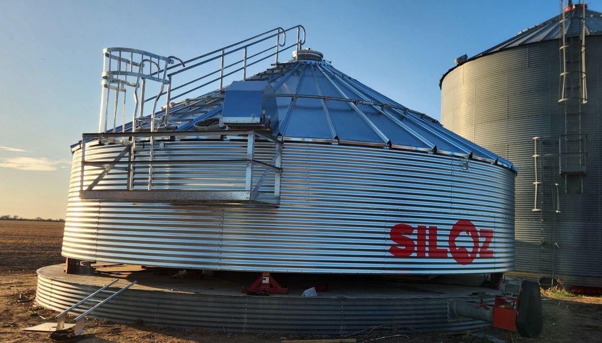 A Large Metal Silo is Sitting in the Middle of a Field — Welders In Gilgandra, NSW