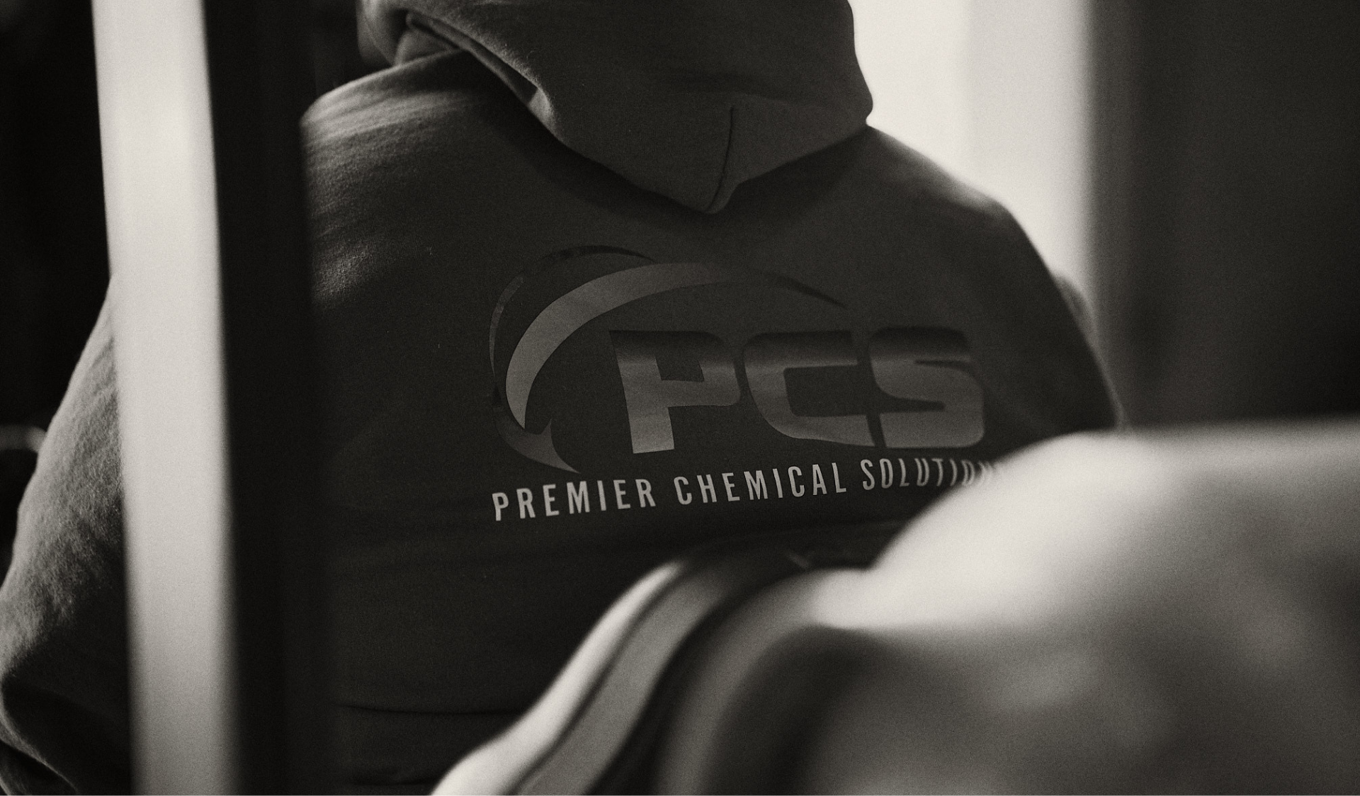 Person wearing a hooded sweatshirt with