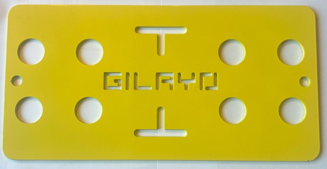 Yellow plastic stencil with the word 