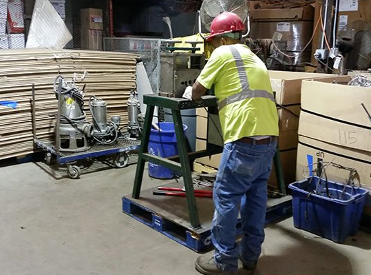 Man Working on A Metal — Freehold, NJ — Beacon Scrap Iron and Metal Co.