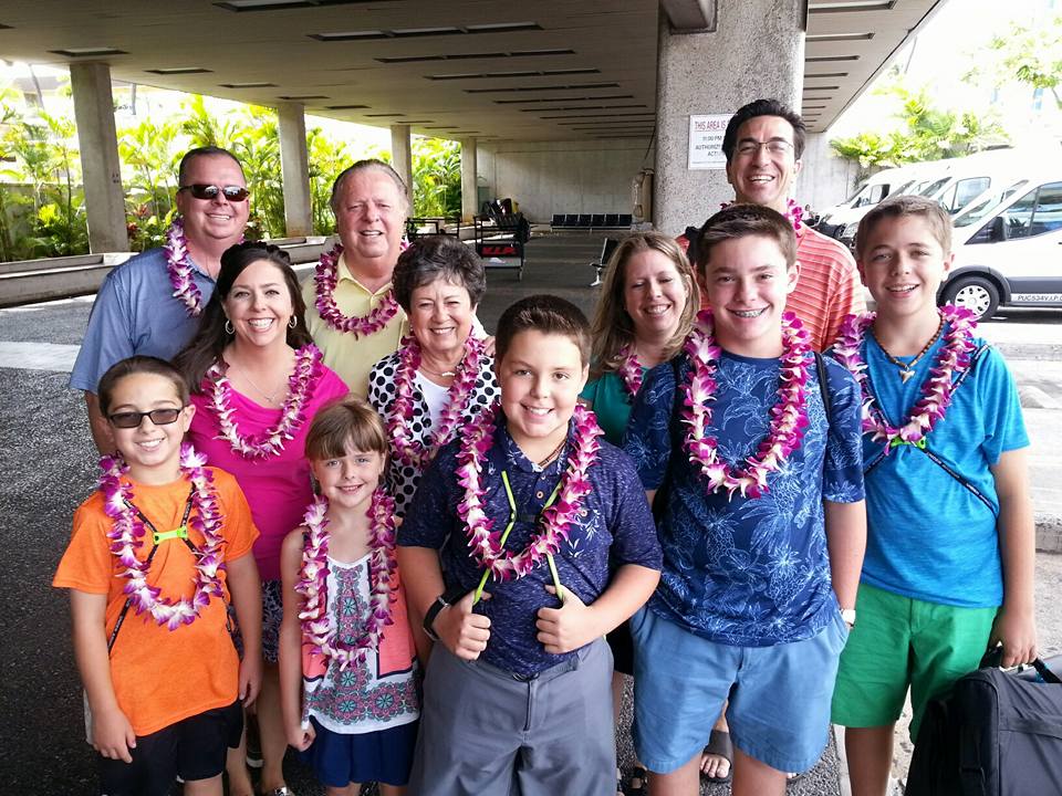 Man providing traditional Hawaiian lei greeting in Oahu