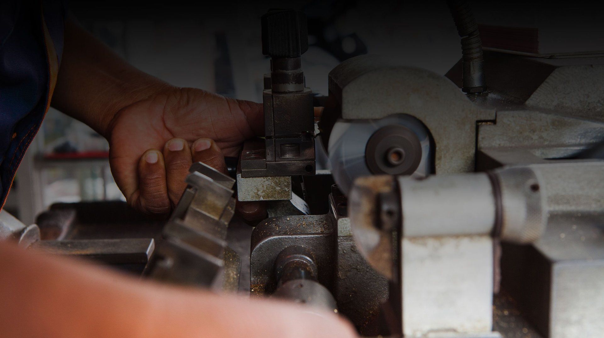 Person cutting keys with a key cutter