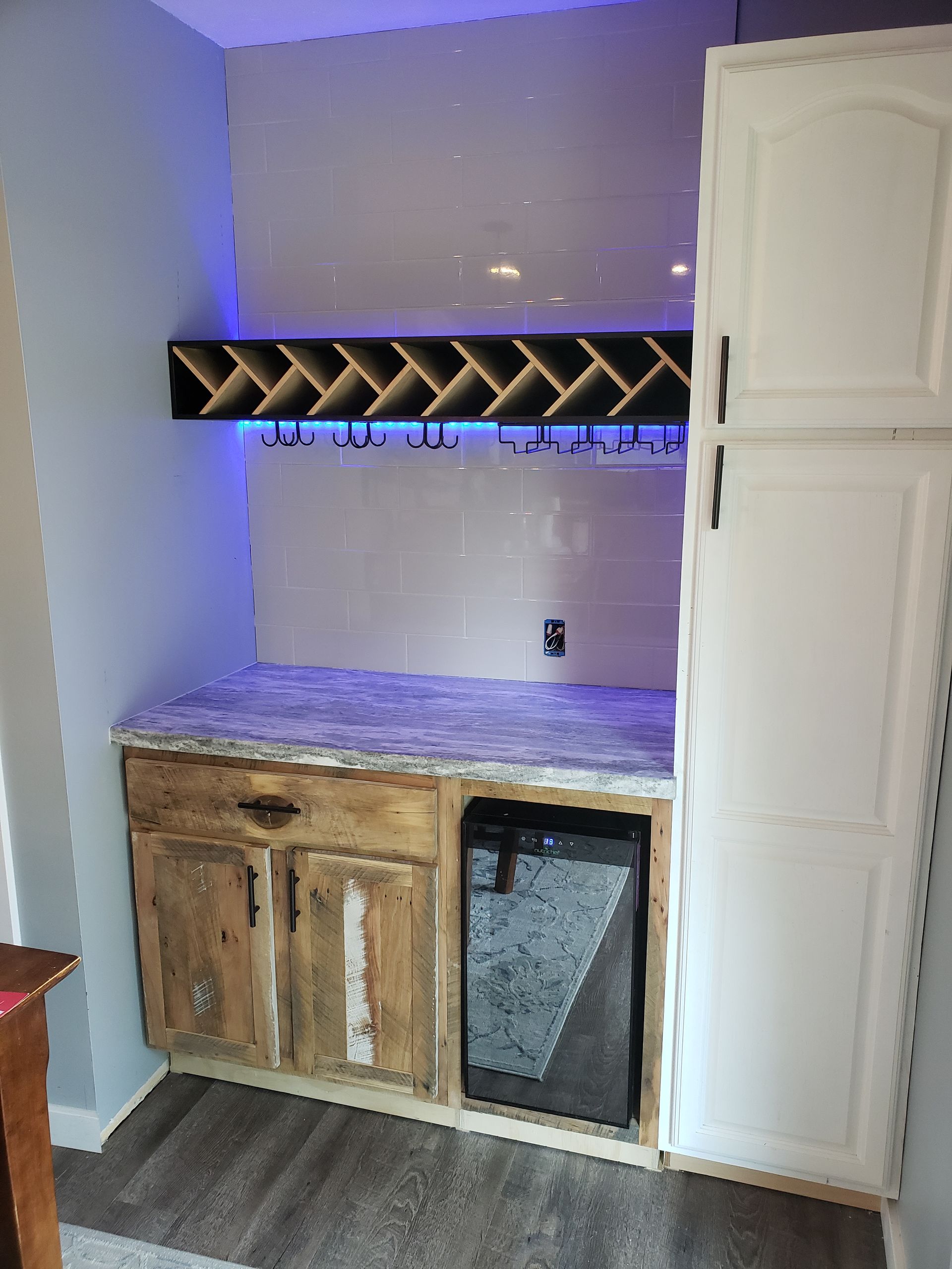 Custom built side area and lit shelves