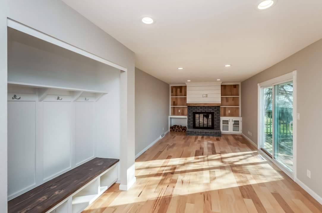 Flooring Remodel with Fireplace and Shelving