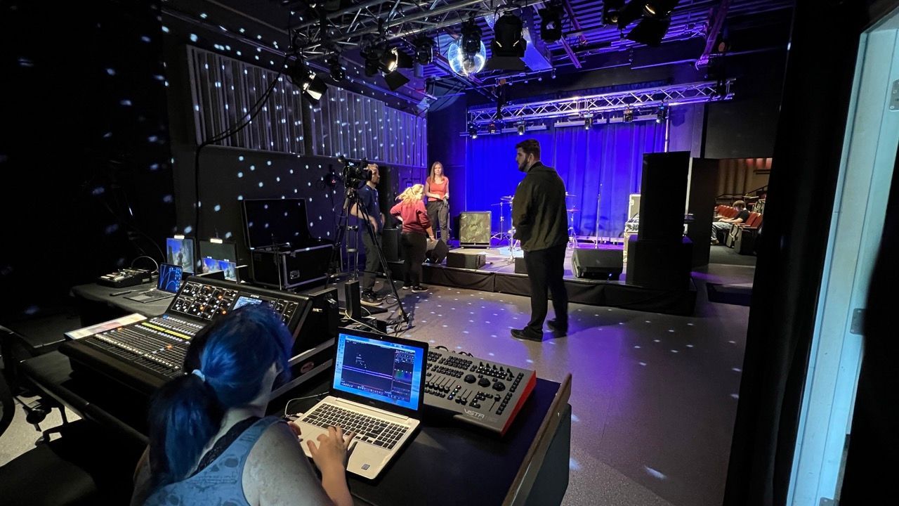 Music students learning live sound techniques