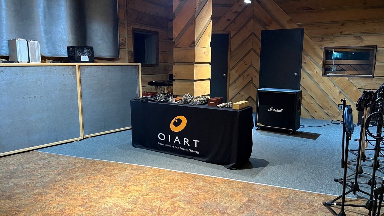 A room with a table and a sign that says OIART