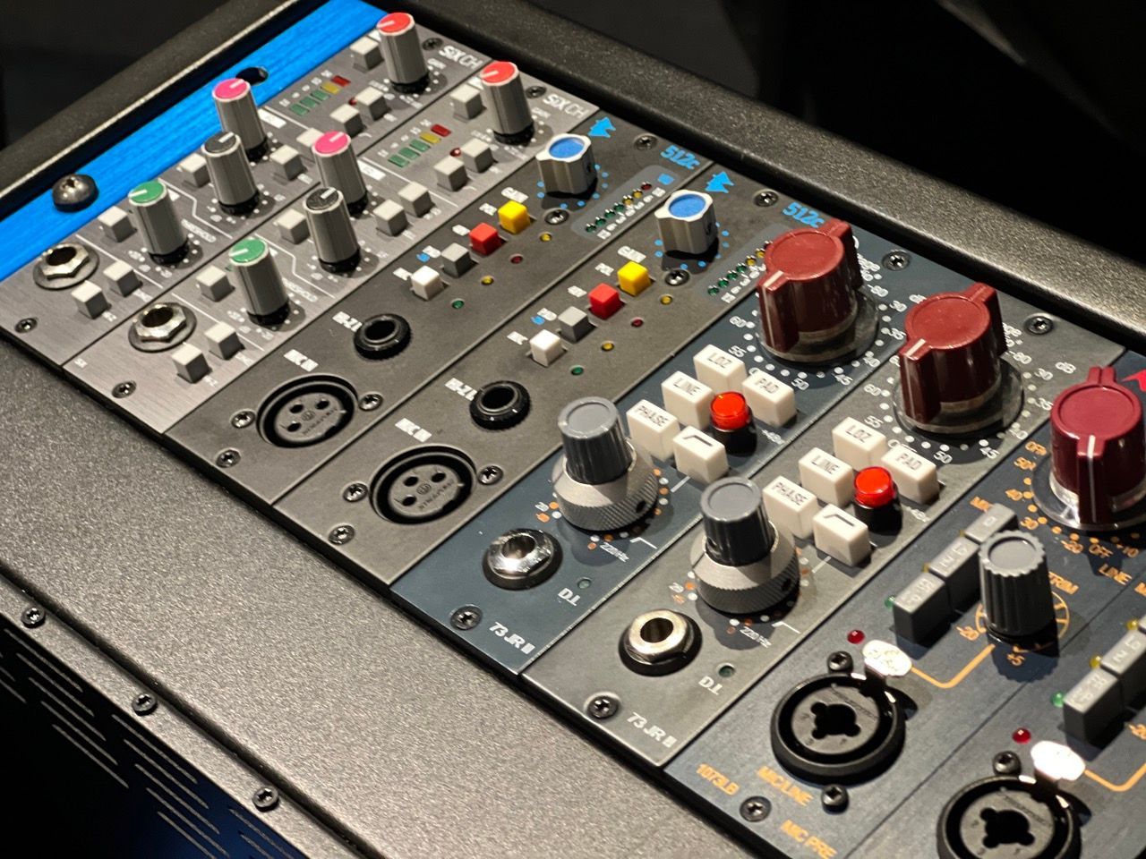 A mixer with a lot of knobs and buttons on it