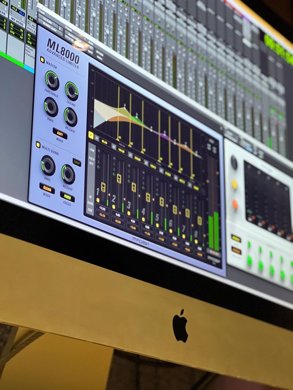 An apple computer with a mixer on the screen