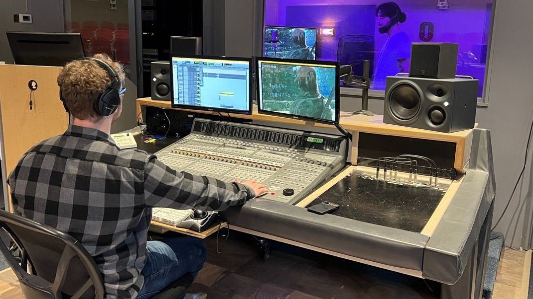 Man on mixing board for tv promotion