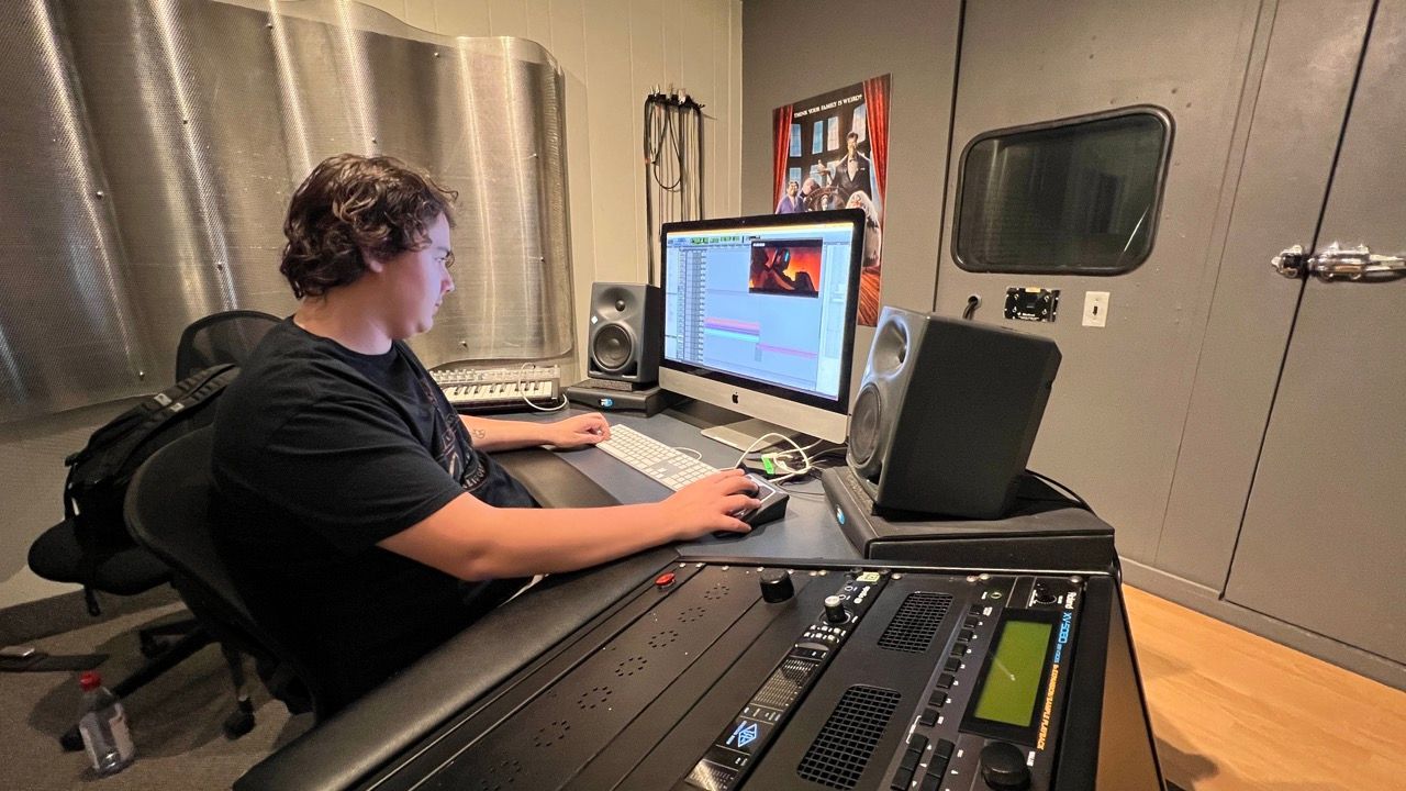 man working on auido mix at OIART