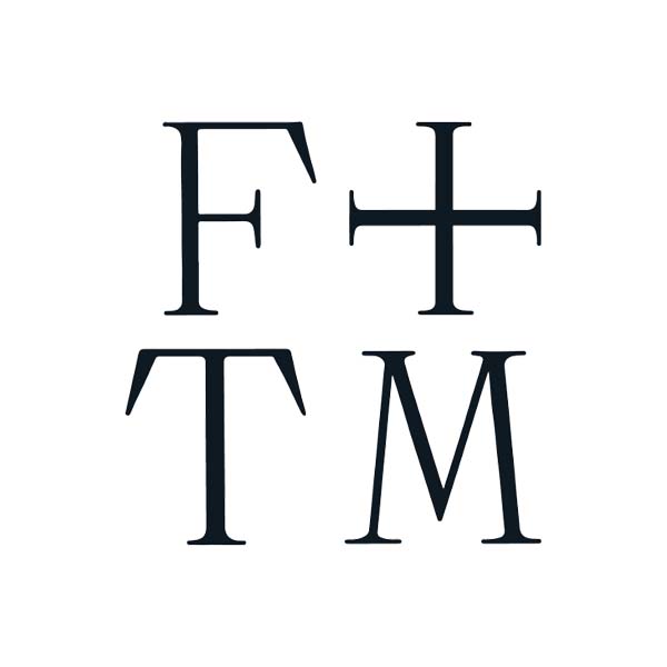 A logo for a company called f + tm with a cross in the middle.