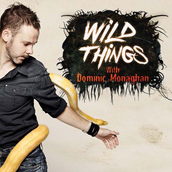 A man with a snake around his arm is on the cover of wild things