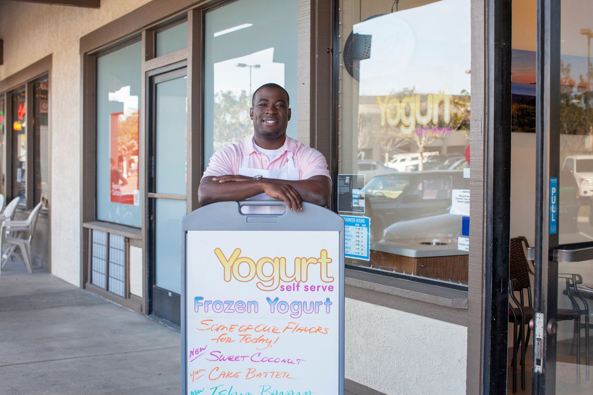 Man smiling, standing by a
