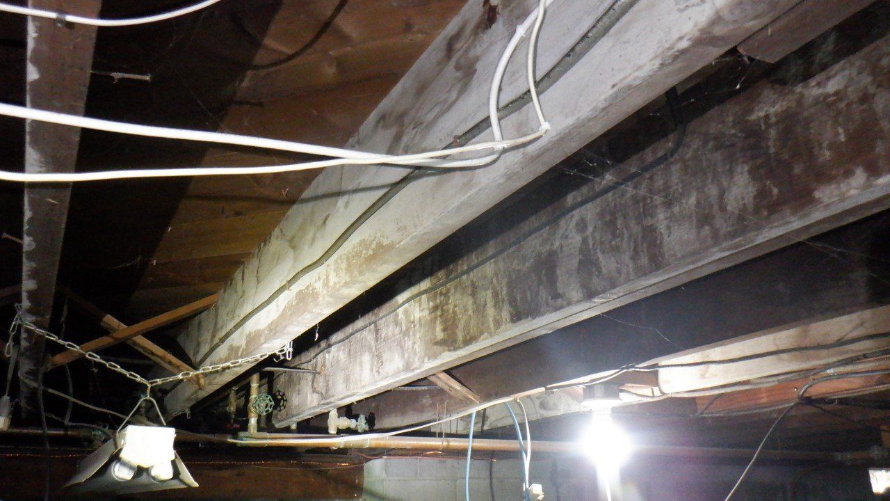 A ceiling with a lot of wires hanging from it