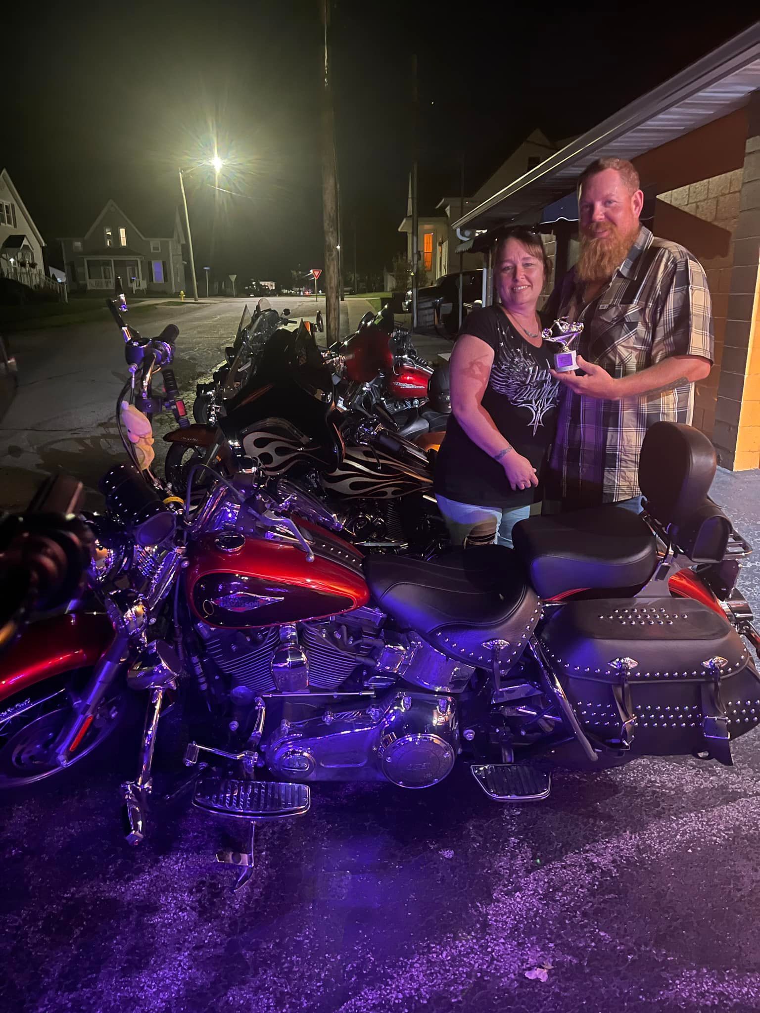 Couple with Large Motorbike