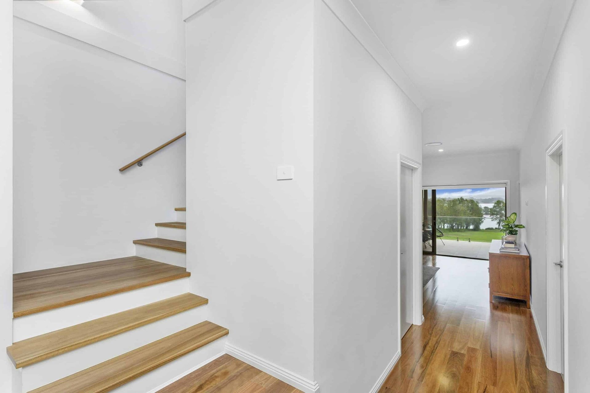 A Hallway With Stairs Leading Up to the Second Floor of a House — Evolution Building Group Dapto, NSW