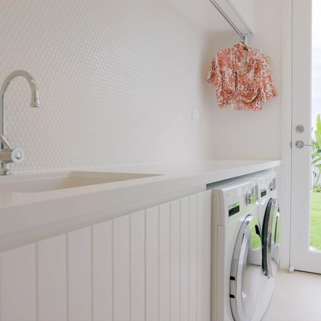 A Laundry Room With a Washer and Dryer and a Sink — Evolution Building Group Dapto, NSW