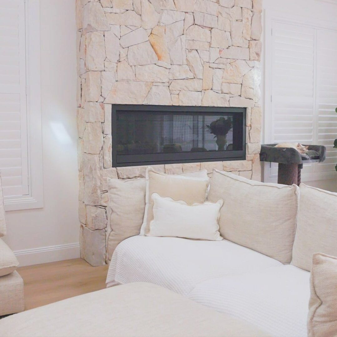 A Living Room With a Fireplace and a Couch — Evolution Building Group Dapto, NSW