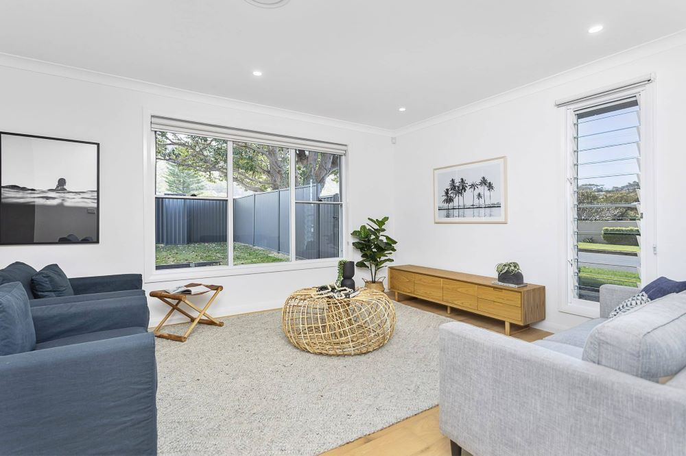 A Living Room With a Couch, Chairs, and a Coffee Table — Evolution Building Group Dapto, NSW
