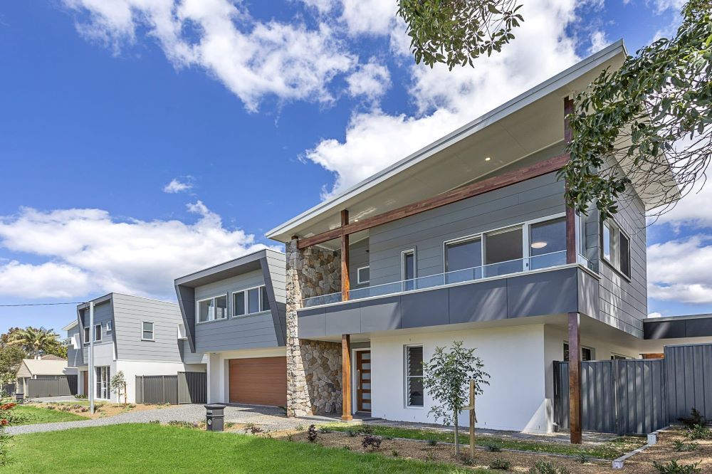 A Large House With a Lot of Windows and a Balcony — Evolution Building Group Dapto, NSW