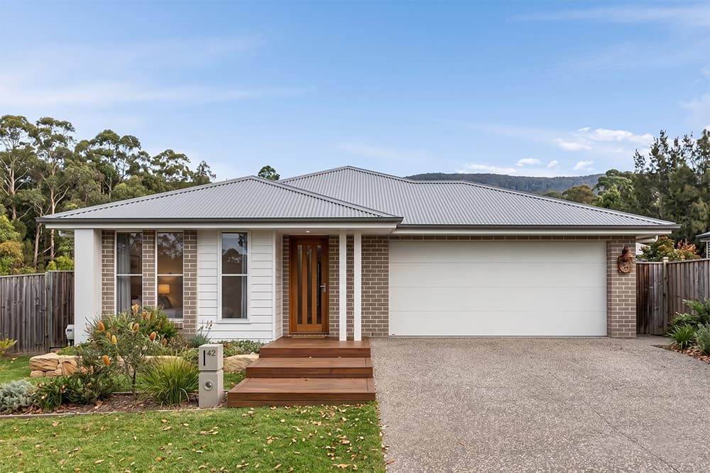 A Small House with A Black Roof and White Windows — Evolution Building Group Dapto, NSW