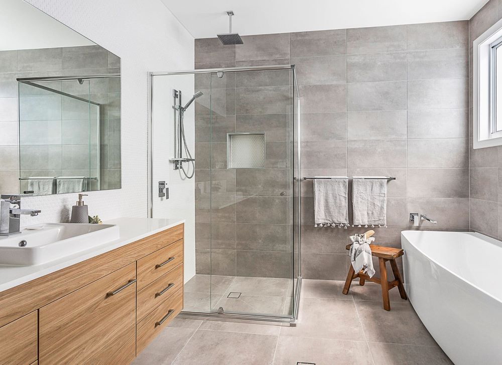A Bathroom With a Walk in Shower, Sink, and Bathtub — Evolution Building Group Dapto, NSW