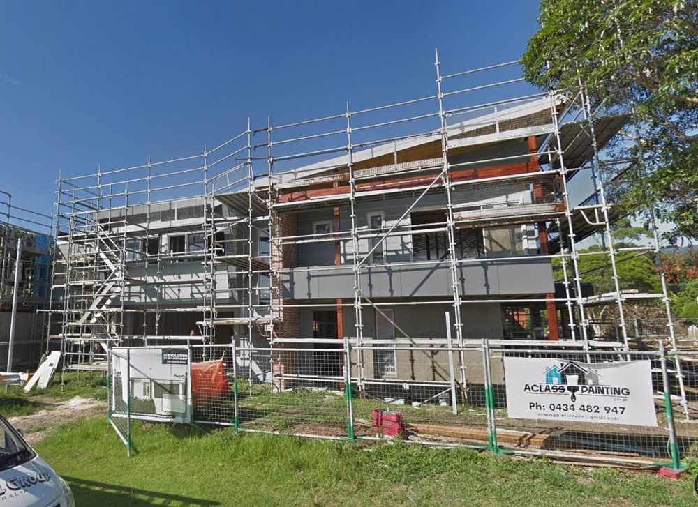 A Large Building is Being Built With Scaffolding Around It — Evolution Building Group Dapto, NSW
