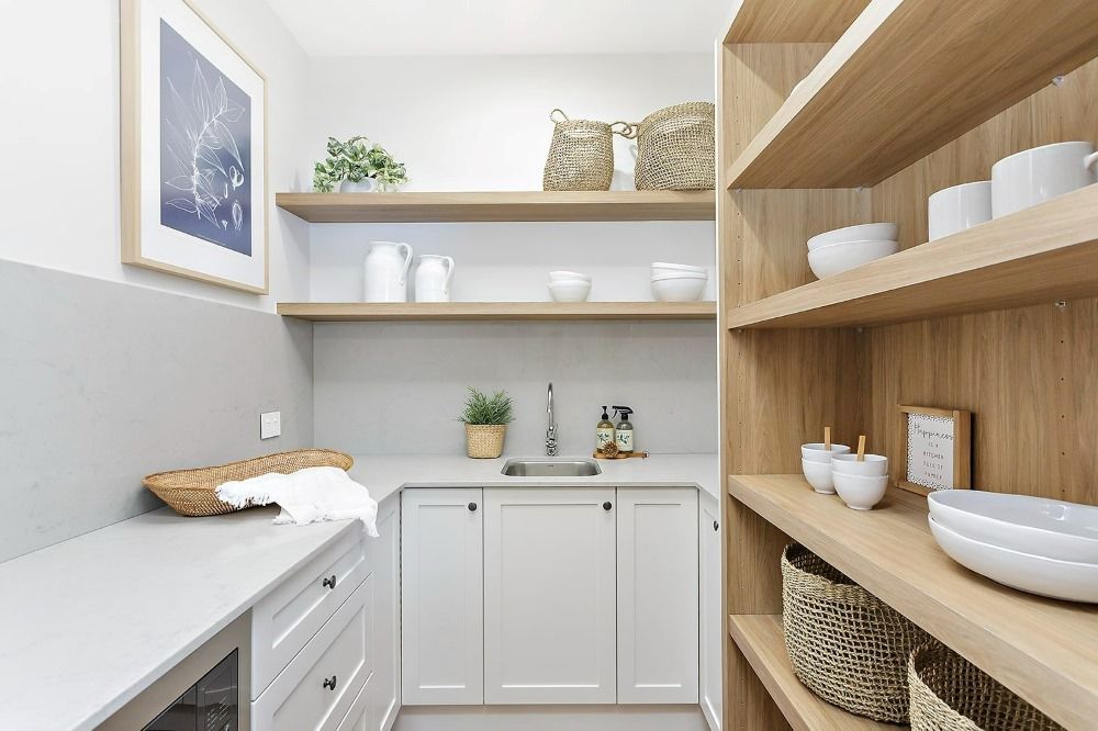 A Kitchen With White Cabinets, Wooden Shelves and a Sink — Evolution Building Group Dapto, NSW