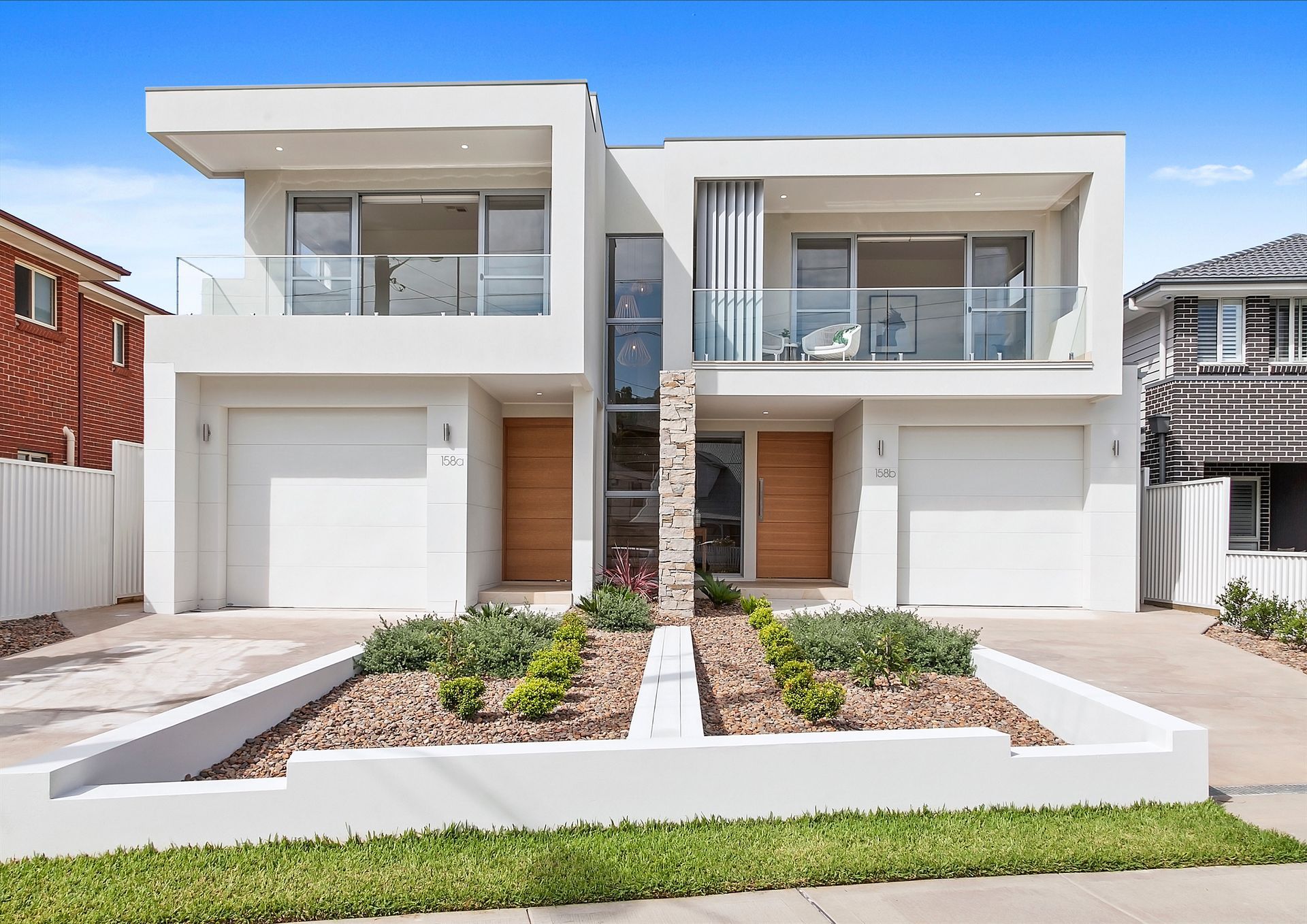 A House with A Patio and A Table and Chairs in The Backyard — Evolution Building Group Dapto, NSW