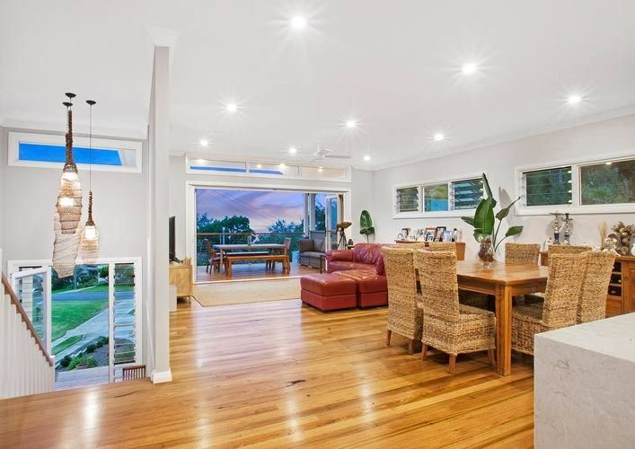A Living Room and Dining Room in a House With Wooden Floors — Evolution Building Group Dapto, NSW