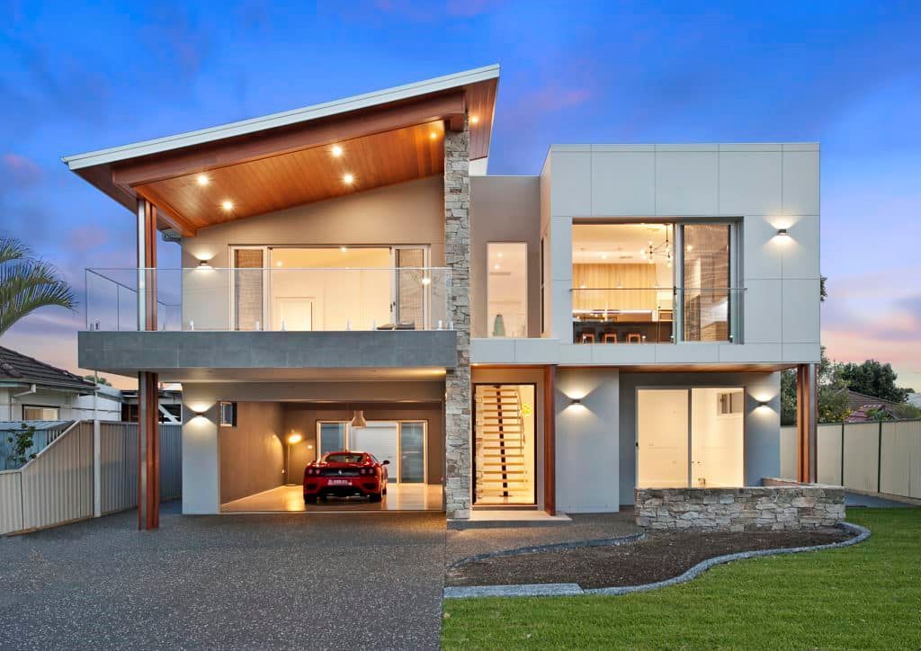 A Modern House with A Car Parked in Front of It — Evolution Building Group Dapto, NSW