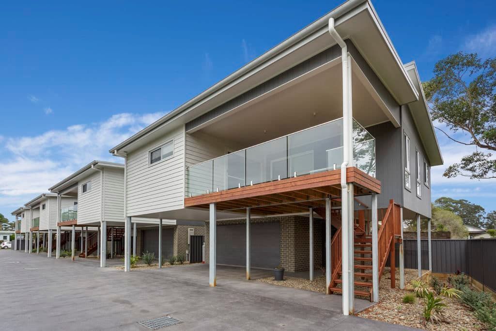 A Large House with A Lot of Windows and Balconies — Evolution Building Group Dapto, NSW
