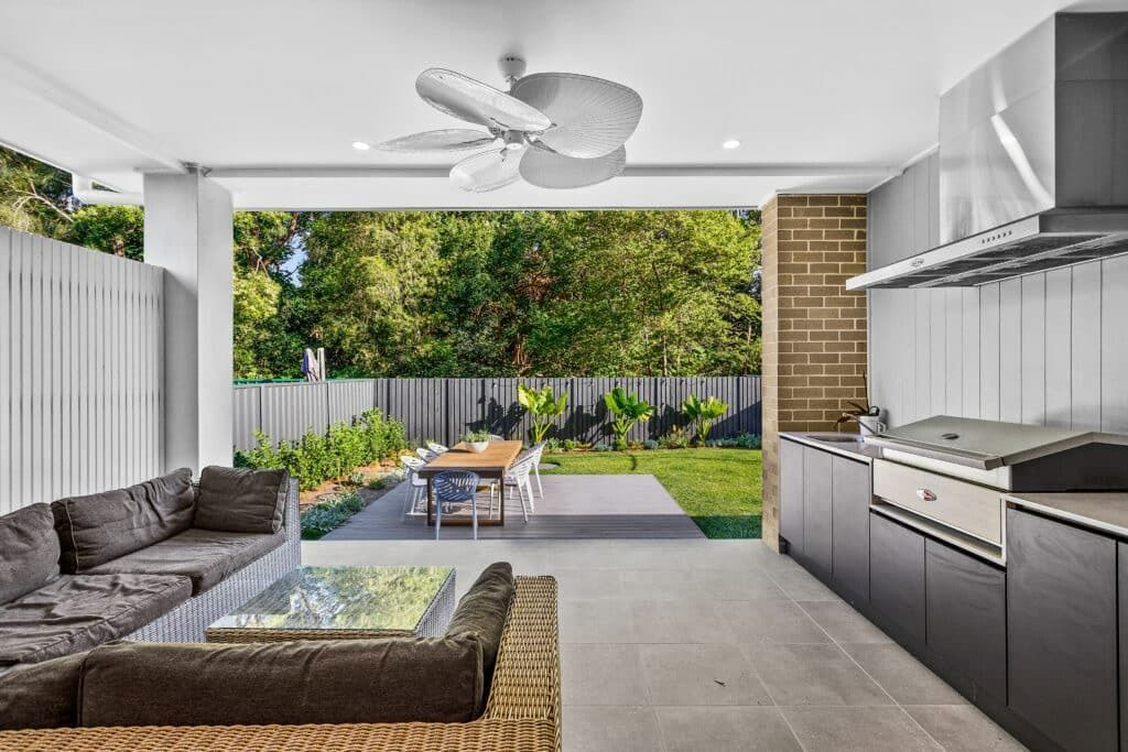 A Living Room with A Couch, Table, and Ceiling Fan — Evolution Building Group In Wilton, NSW