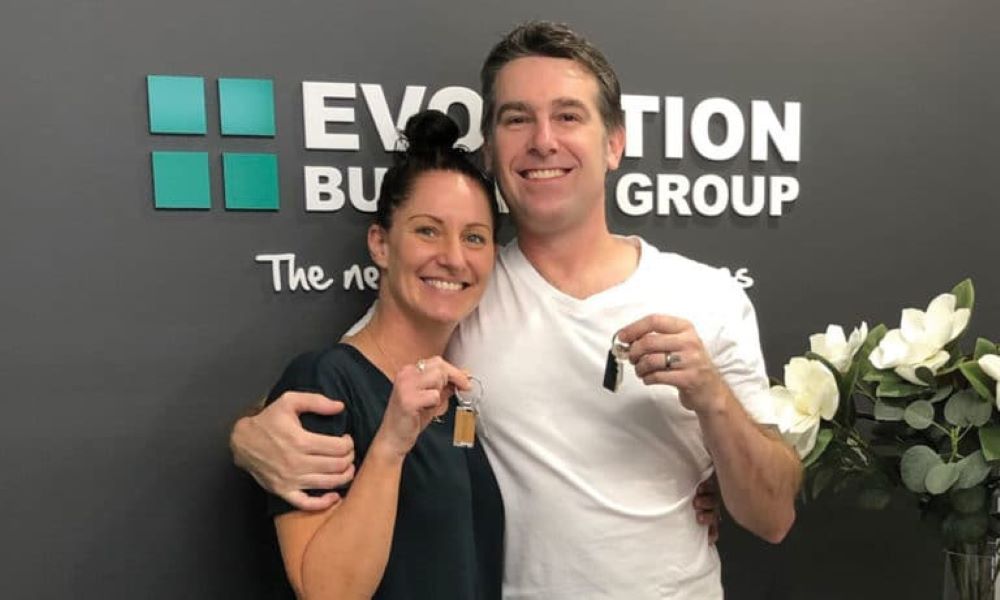 A Man and A Woman Are Standing Next to Each Other — Evolution Building Group Dapto, NSW