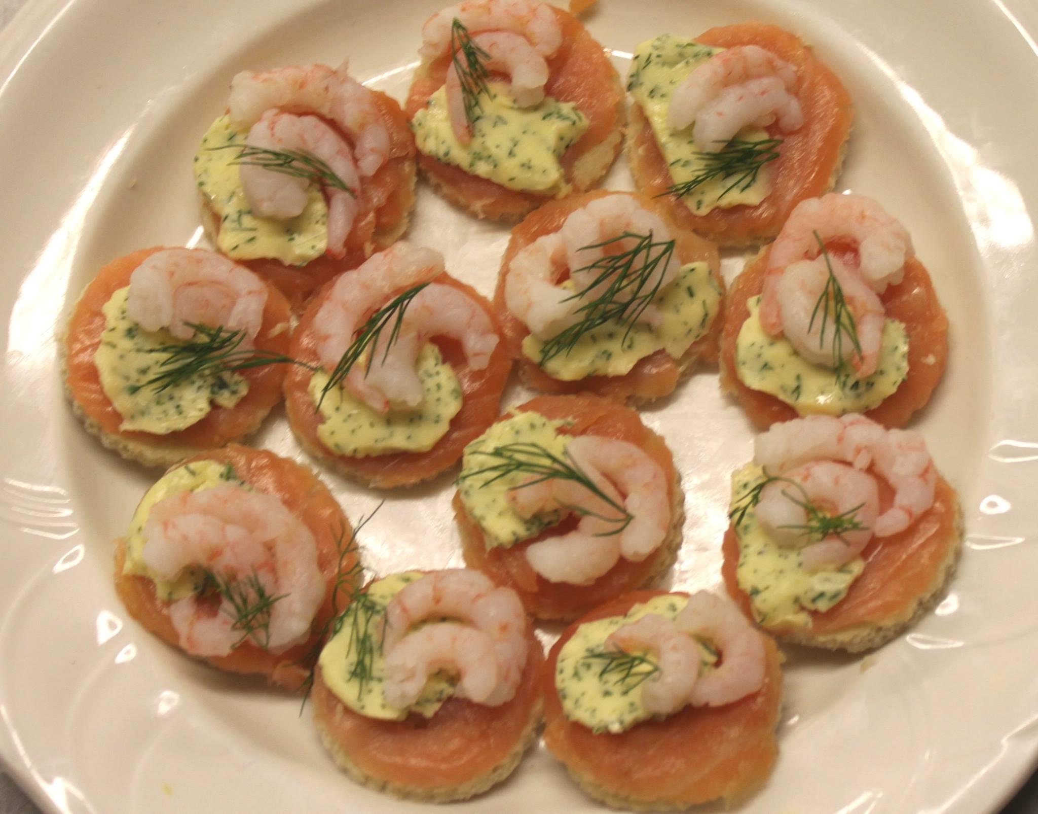 Smoked salmon and dill butter on a crouton canape.