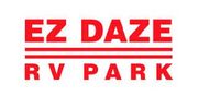 A red and white logo for ez daze rv park.