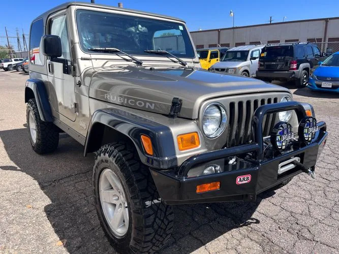 A jeep wrangler rubicon is parked in a parking lot. | Ridgeline Automotive