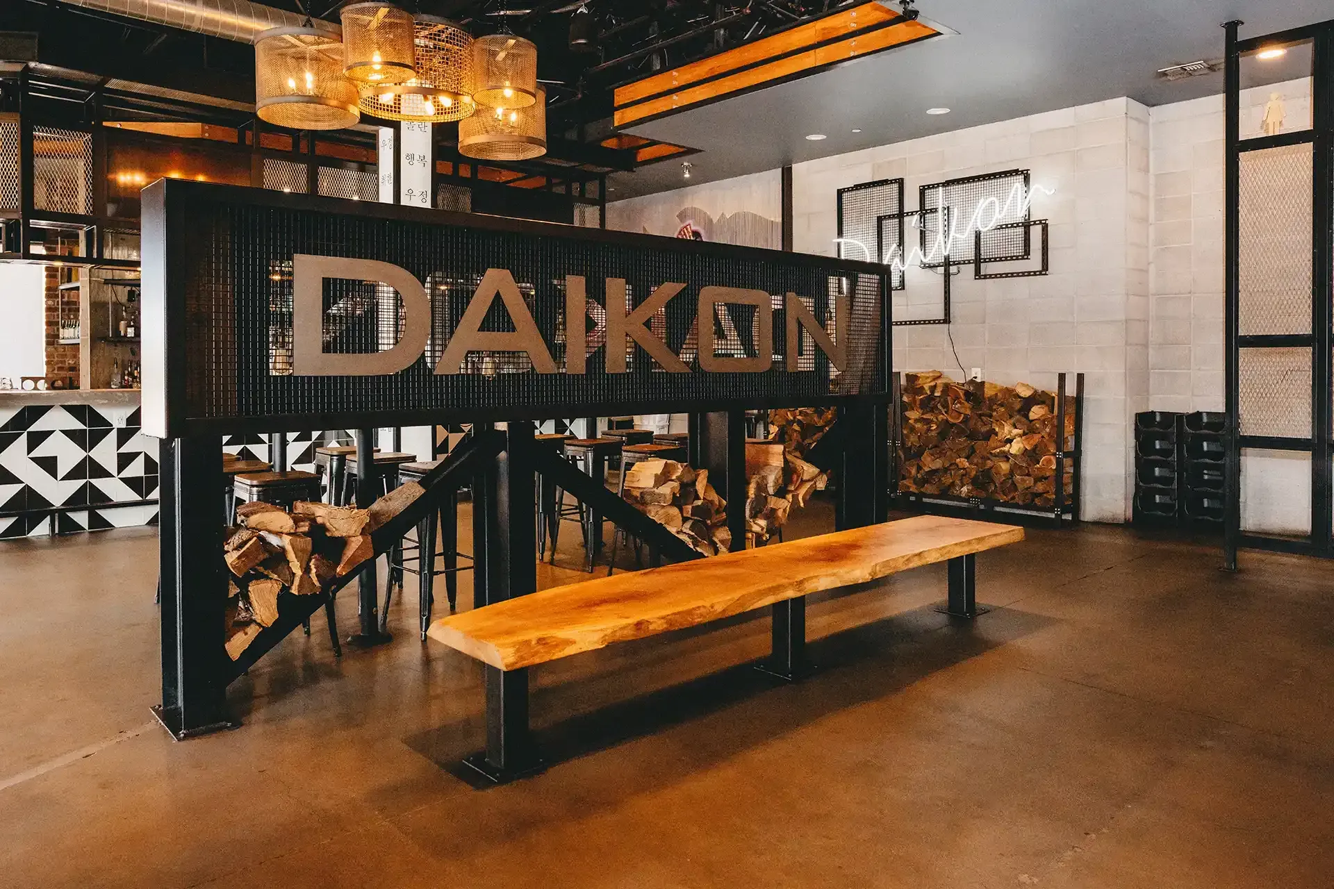 A room with a wooden bench and a sign that says daikon