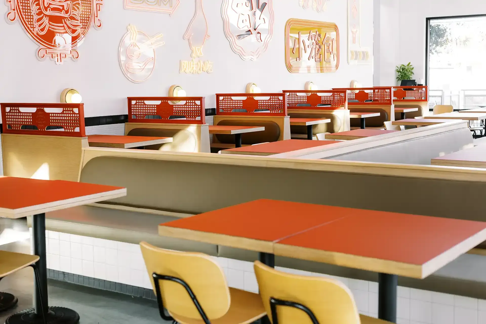 A diner with red tables and yellow chairs