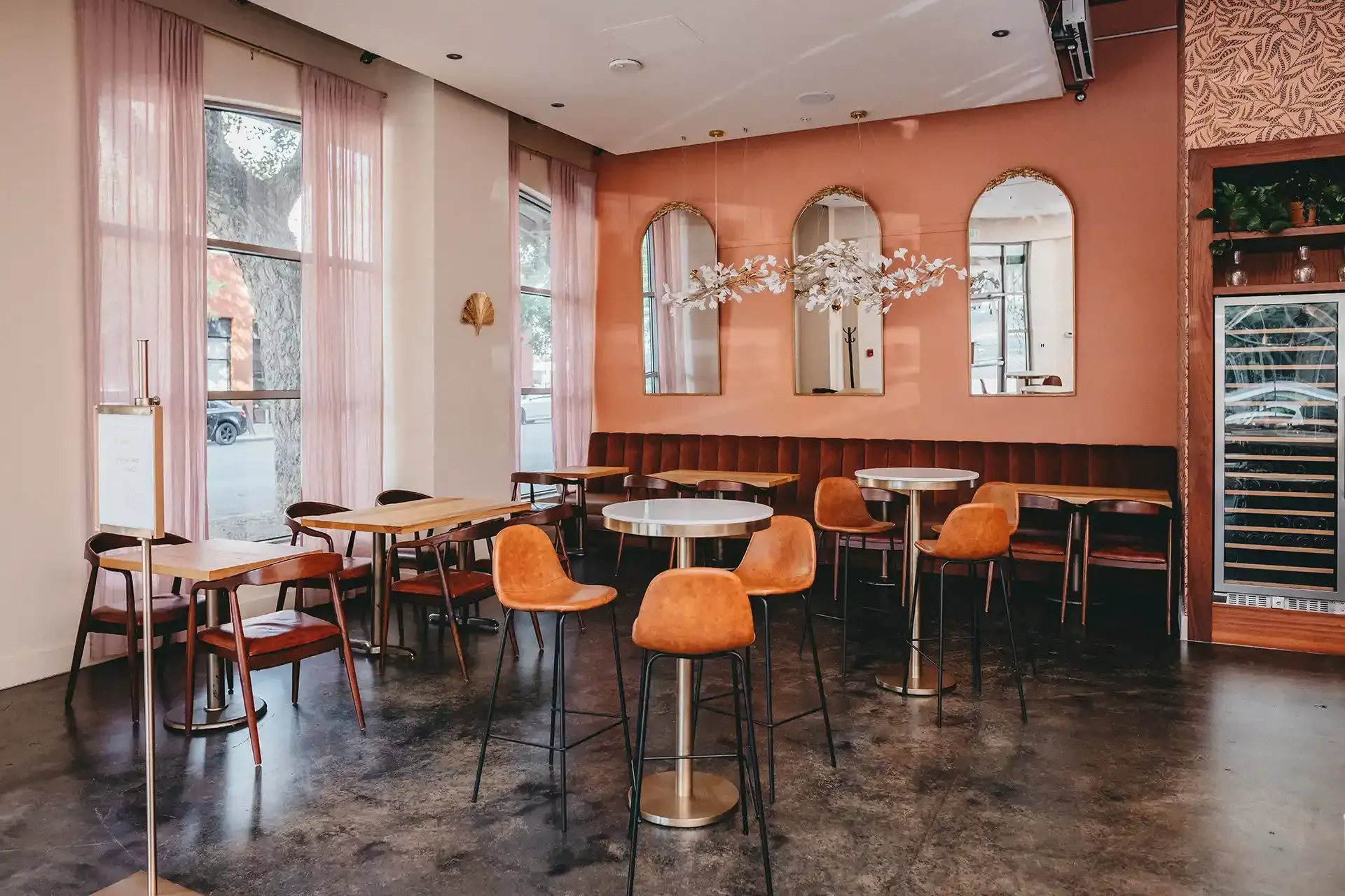 A restaurant with tables and chairs