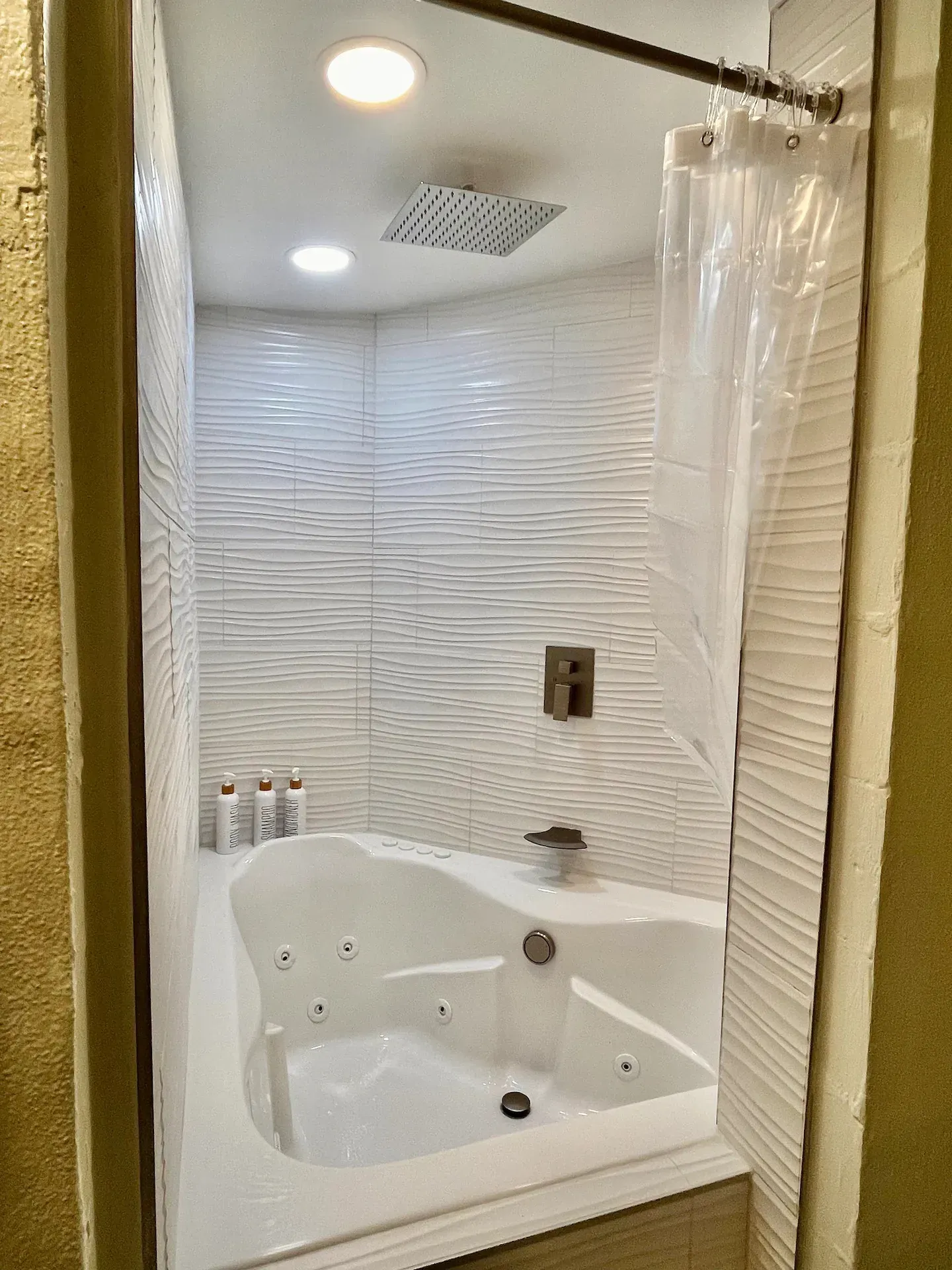 A bathroom with a jacuzzi tub and a shower.