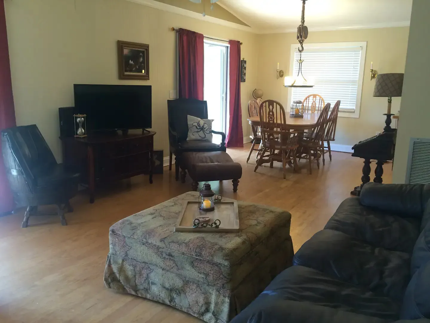 A living room with a couch a table and chairs