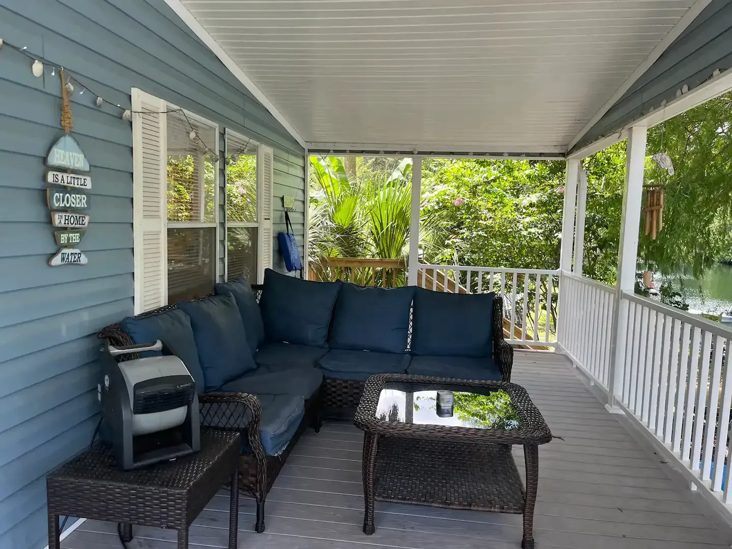 A porch with a couch and a coffee table