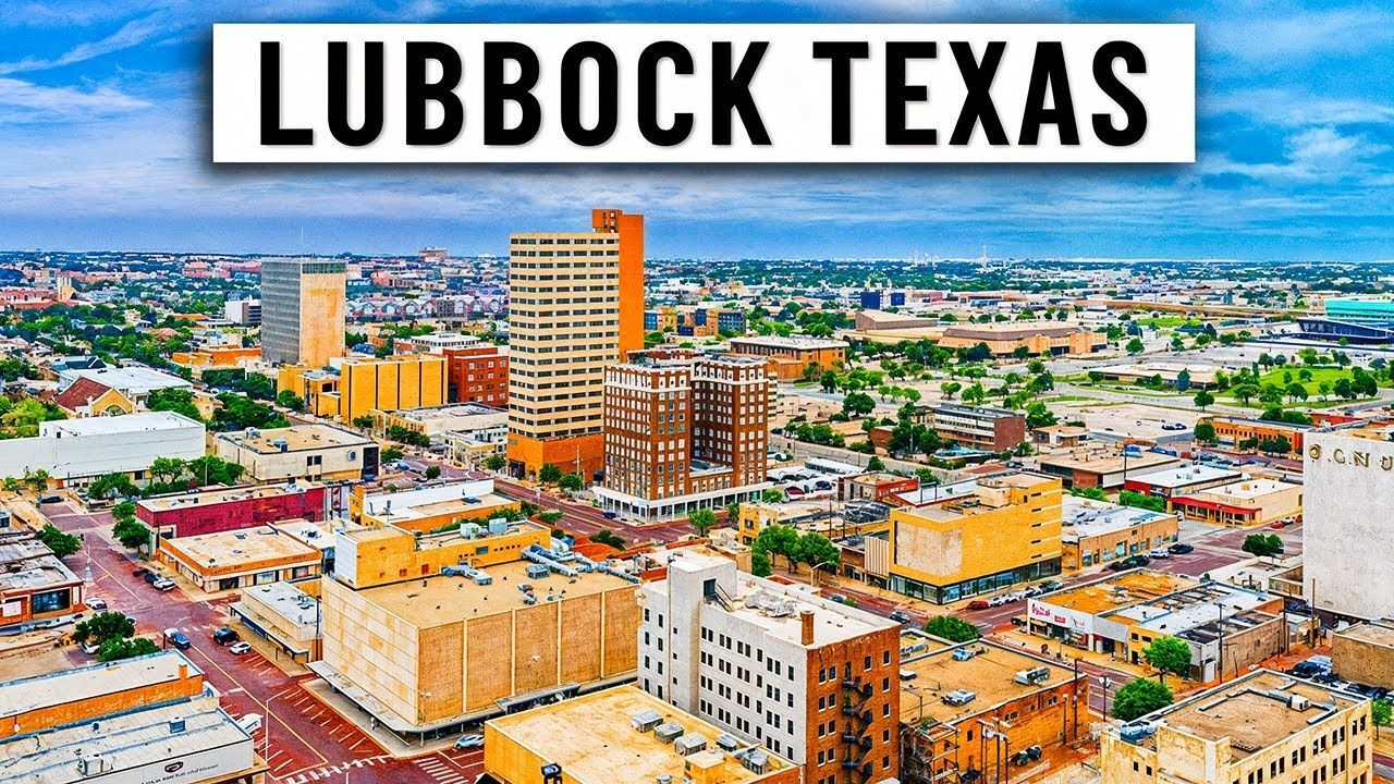 Aerial view of Lubbock, Texas, showcasing downtown buildings and a clear blue sky.