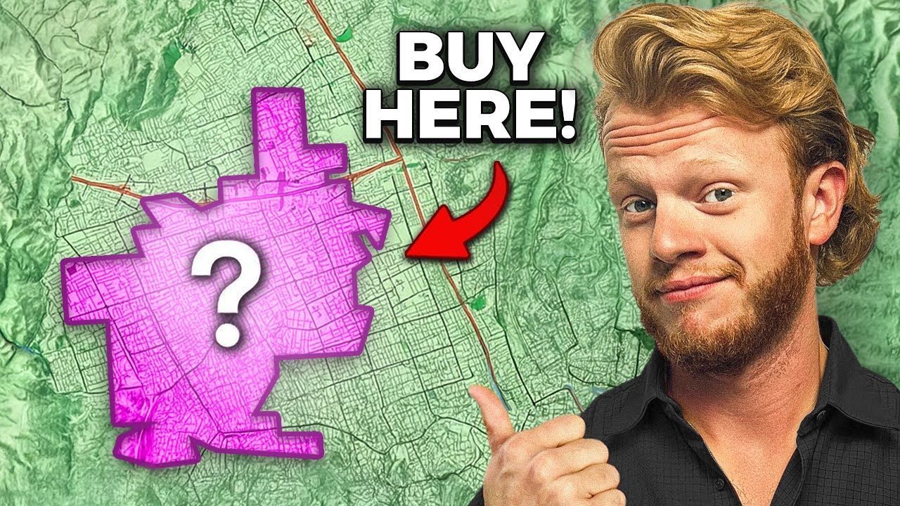 Man points to a pink map with a question mark, 